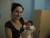 Une maman debout,habillee pour etre avec son tresor